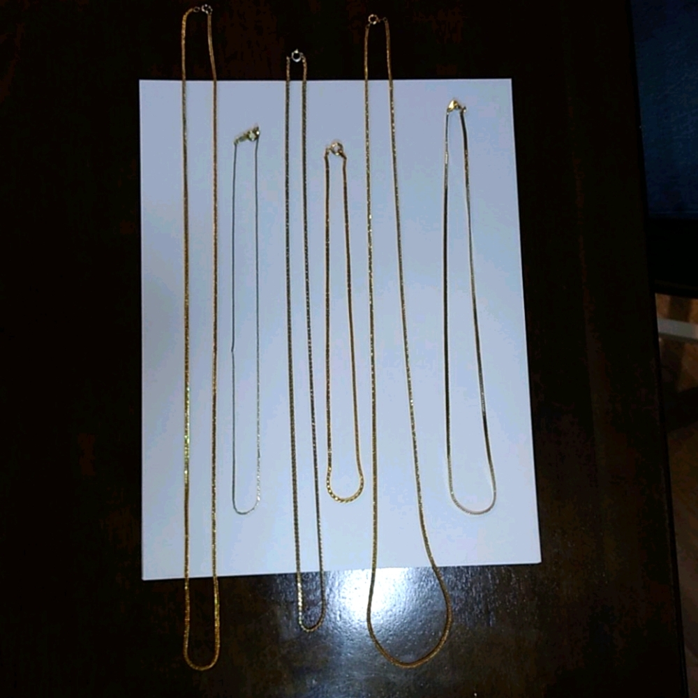 6 assorted gold colored chains
